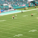 Illustration for article titled Tiny Child On Field Cant Stand Titans-Dolphins Weather Delay